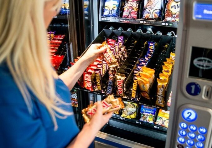 Snack trays being loaded during a scheduled restock